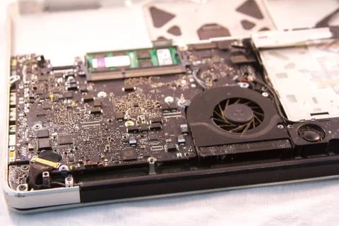 Fixing a hard disk drive with one hand with gloves and a special tweezers Stock Photos