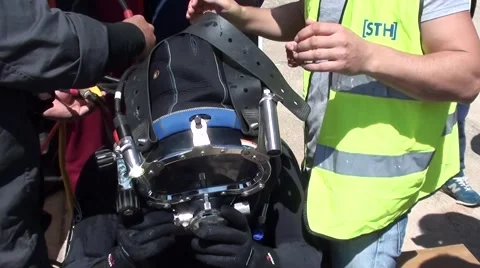Fixing hard-head on a diver Stock Footage 48858586