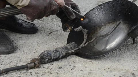 Fixing iron pan. Stock Footage 77749222