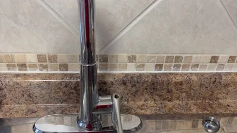 Fixing a kitchen faucet Stock Footage 219976478