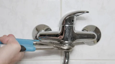 Fixing a leak Stock Footage 98217224