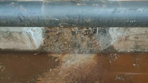 Fixing Leaking Water Pipeline: Emergency Pipe Repair Stock Footage 337156012