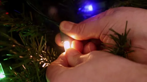 Fixing loose chistmas light Stock Footage 323246320