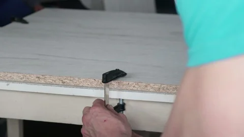 Fixing  melamine laminate with quick vise on the table Video stock 108154688