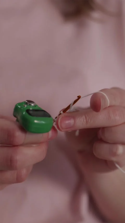 Fixing a mistake in knitting pattern vertical close up shot 스톡 동영상 337451959