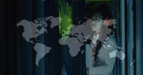 Fixing network cables by headset tech on blinkingLED server racks in datacenter Foto stock