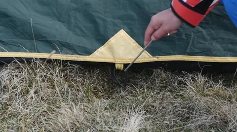 Fixing the outer layer of the tent Video stock 63365488