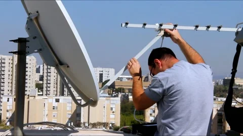 Fixing of receiving device of satellite dish Video stock 64067814