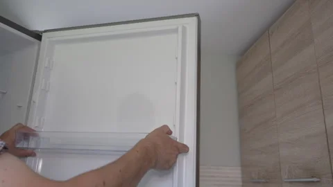 Fixing refrigerator door shelf Stock Footage 327022451