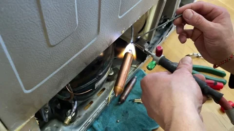 Fixing the refrigerator that not cooling enough by recharging Freon tube. Master Stock Footage 270213322