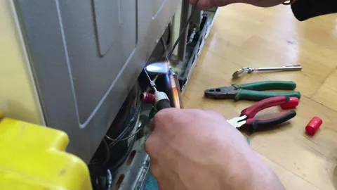 Fixing the refrigerator that not cooling enough by recharging Freon tube. Master Stock Footage 277076542