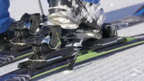 Fixing the ski boot to the ski Stock Footage 72375709