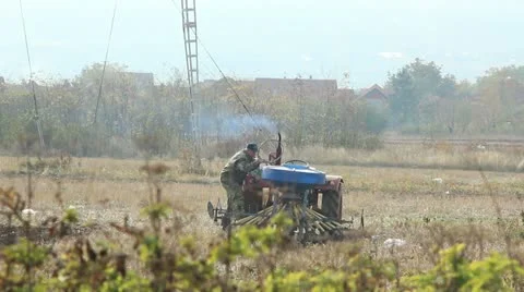 Fixing a tractor Stock Footage 12522265