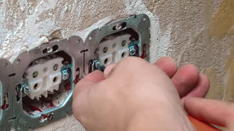 Fixing Triple Sockets Using Hand Tools And Brackets Inside Walls 库存影片 329106378