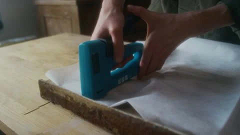 Fixing Upholstery Wadding on Chair Framework with Construction Stapler Video stock 291626674