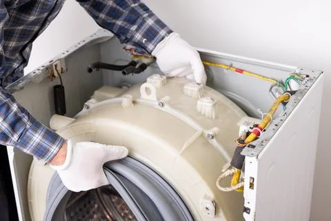 Fixing washing machine Stock Photos