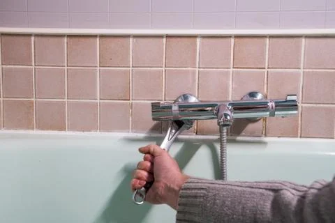 Fixing water tap Stock Photos