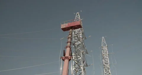 Fixing the wires on the electric tower Stock Footage 229484395