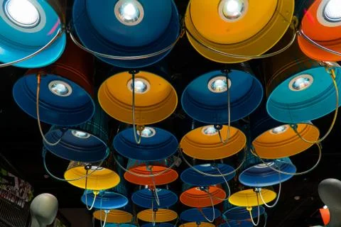 Fixtures in the form of multi-colored buckets Stock-Fotos
