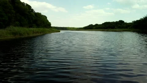 Fiying over the river in the forest in summer Stock Footage 160076348