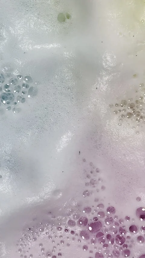 Fizz from colorful bath bombs creates unique graphic element Stock Footage 334763131
