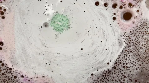 Fizzing bath bomb creates surreal nebula graphic element Stock Footage 334053562