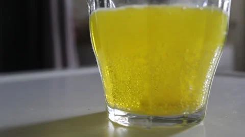 Fizzing Vitamin c tablet dissolving in water Stock Footage 311753292
