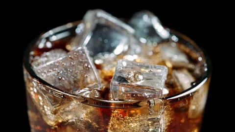 Fizzy Cola Soda with Ice Cubes in Glass, Close Up Stock Footage 346086151