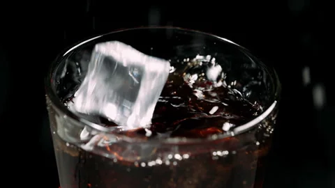 Fizzy Cola Soda with Ice Cubes Close-Up in Glass Stock Footage 346086183