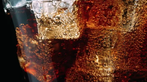 Fizzy Cola Soda with Ice Cubes, Extreme Close-Up Stock Footage 346087662