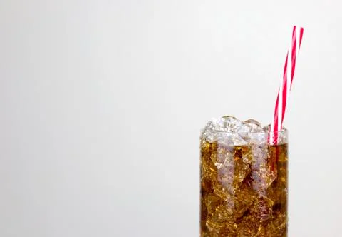 Fizzy Drink With Ice Against a White Background 写真素材