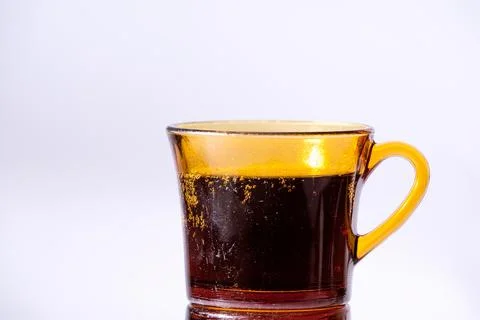 Fizzy drink in an old cup. Photos