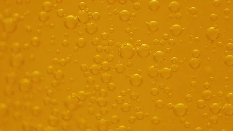 Fizzy soft orange drink bubbles floating macro slow motion 720p Stock Footage 74807112