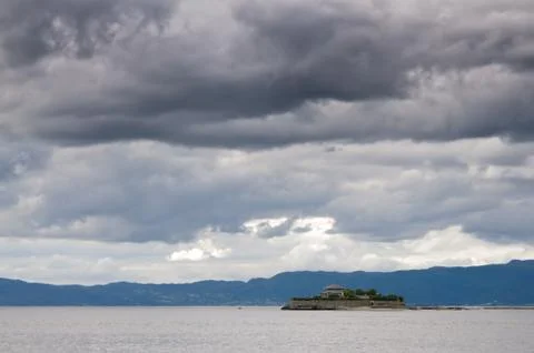 Fjord landscape of dramatic sky and sea near Munkholmen Stock Photos