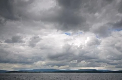 Fjord landscape of dramatic sky and sea Stock Photos