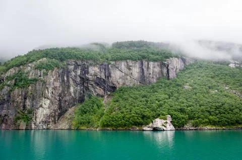 Fjord rocks with vertical cliffs and amazing beautiful water 写真素材