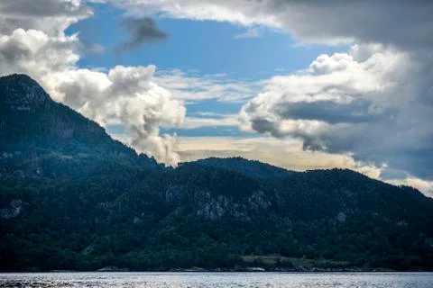 Fjords landscape with clouds in the sky, sunny day in summer Stock Photos