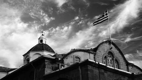 The flag above the church Stock Footage 166580708