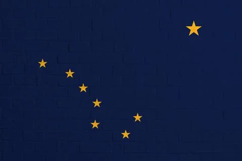 Flag of Alaska. Brick wall texture of the flag of Alaska Stock Photos