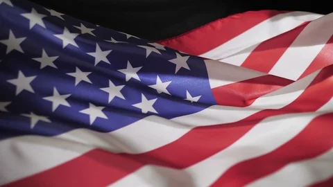 Flag of America in the wind on black background, slow motion Stock Footage 87731918