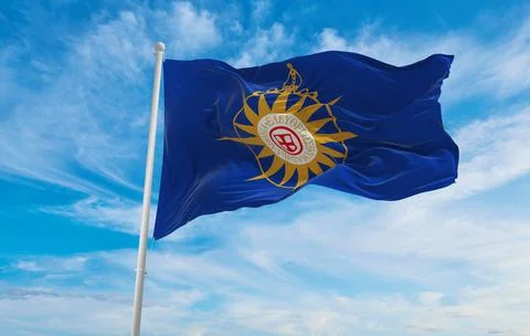 Flag of Anglican rose  at cloudy sky background on sunset, panoramic view. un Stock Illustration