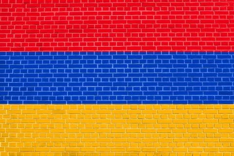 Flag of Armenia on brick wall texture background. Armenian national flag. Stock Illustration