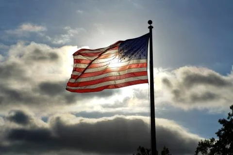 Flag Backlit by the Sun Stock Photos