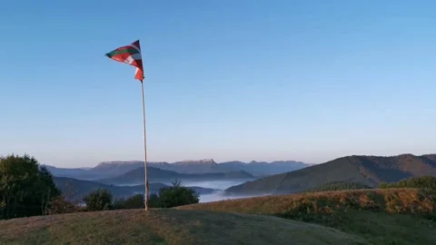 Flag of the Basque Country waving at mountain Stock Footage 140450484