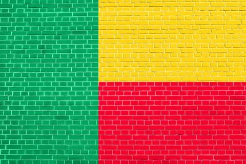 Flag of Benin on brick wall texture background Stock Photos