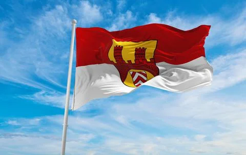 Flag of Bielefeld at cloudy sky background on sunset, panoramic view. Federal Stock Illustration