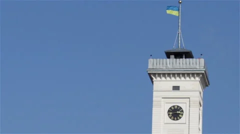 Flag blowing on top of clock tower Stock Footage 49169571