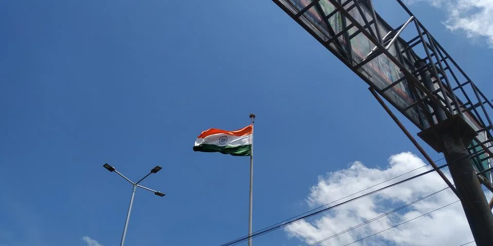 Flag with blue cloudy sky Stock Photos
