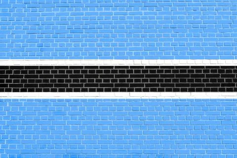 Flag of Botswana on brick wall texture background Stock Photos