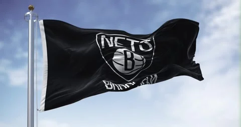 Flag of Brooklyn Nets waving in the wind on a clear day Stock Footage 250170099